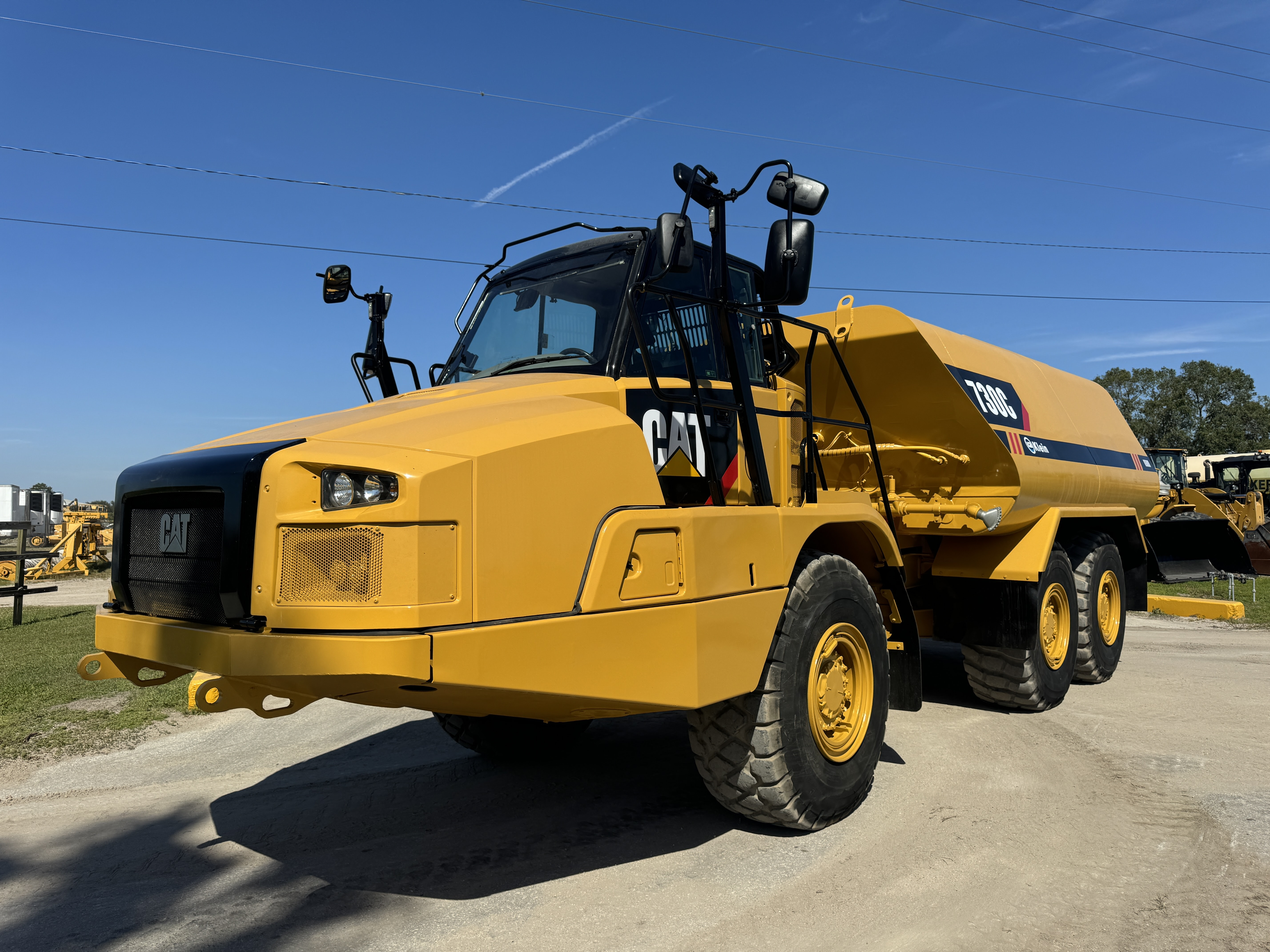 2015 CAT 730C 6,000 GALLON WATER TANKER