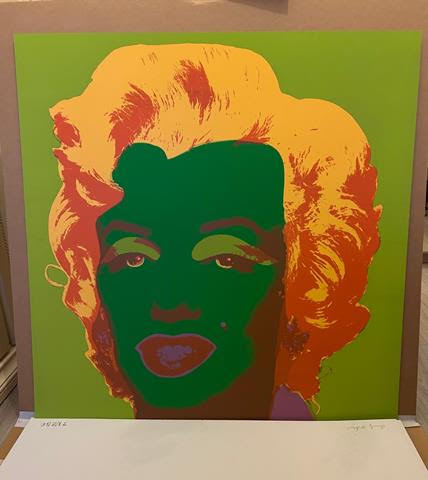 Client would like to sell a portfolio of 10 lithographic prints featuring Marilyn Monroes stylized face.
